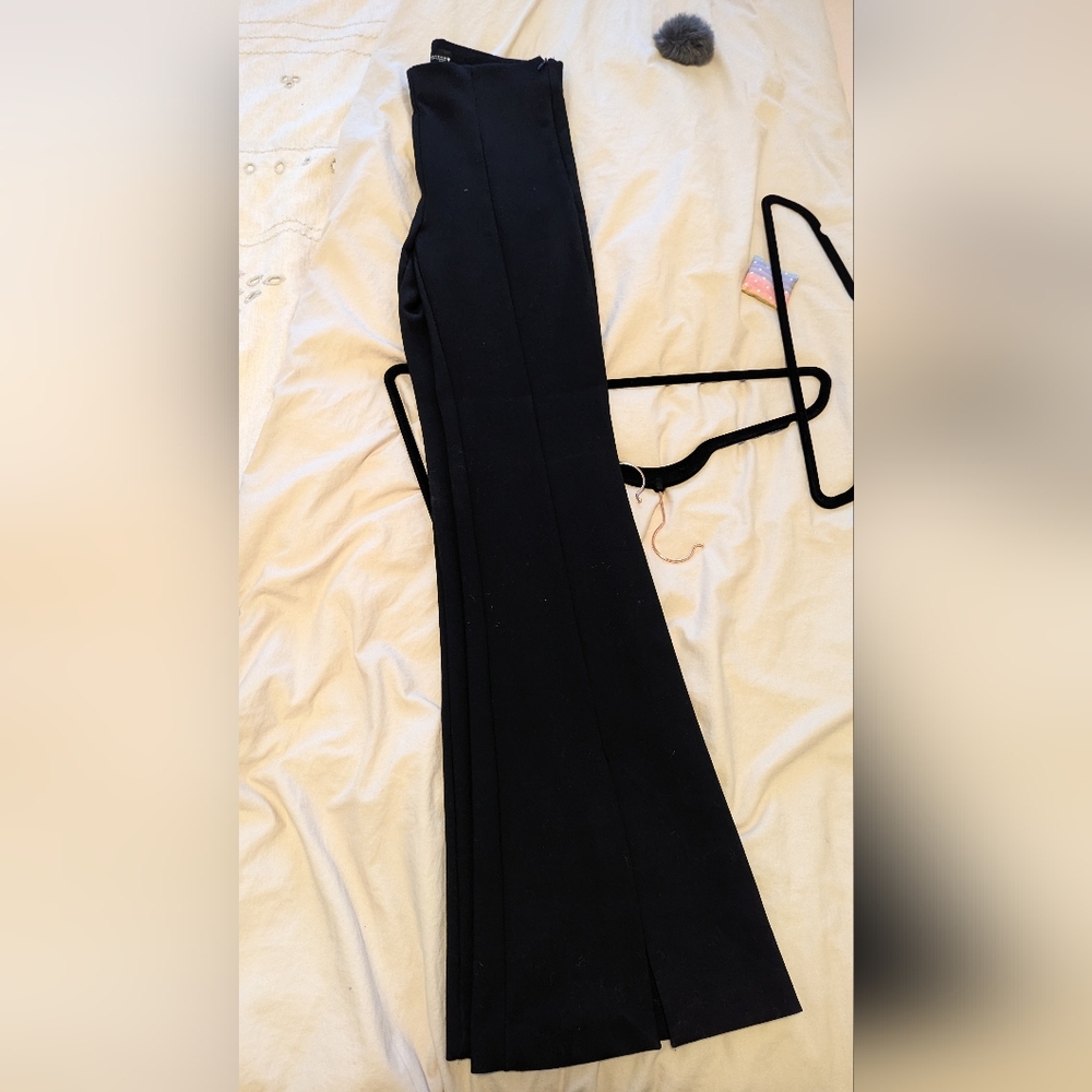 Elegant Black Trousers. Flared With Slits